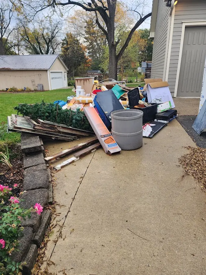 Dumpster being loaded with debris for 3 Yard Dumpster Rental in Carson City